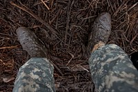 Muddy soldier in training exercise. Original public domain image from Flickr