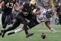 Navy’s Noah Copeland attempts to catch a pass that was broken up by Army’s Josh Jenkins during the 115h Army-Navy football game at M&T Stadium in Baltimore, Md. Dec. 13, 2014.