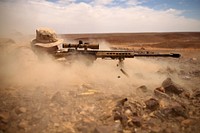 Corporal Drew Eyre, a scout sniper with Weapons Company, Battalion Landing Team 3rd Battalion, 6th Marine Regiment, 24th Marine Expeditionary Unit, fires an M107 Special Application Scope Rifle, or SASR, during a bilateral live-fire exercise with the Jordanian armed forces during Exercise Eager Lion 2015 in Jordan, May 7, 2015.
