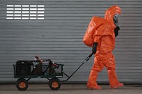 U.S. Army Staff Sgt. Jeff Whalen from the New Jersey National Guard's 21st Civil Support Team pulls a wagon filled with detection gear during a weapons of mass destruction response exercise at the Cherry Hill Armory in Cherry Hill, N.J., June 3, 2015.