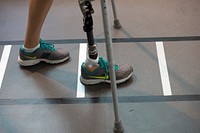 Air Force Capt. Christy Wise practices walking with an artificial limb as she recovers from an above-knee amputation at the Intrepid Center ceremony at San Antonio Military Medical Center in San Antonio, Texas June 12, 2015.