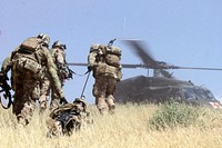Task Force Leader, 3rd BCT, 101st Airborne Division Soldiers evacuate a simulated casualty during a combined arms live fire training exercise May 13, 2015, in Laghman province, Afghanistan.