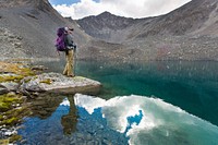 Enjoying an alpine lake near Bremner. NPS photo by Neal Herbert. Original public domain image from Flickr