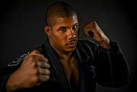 U.S. Air Force Staff Sgt. Leon Jackson, a structural maintenance specialist with the New Jersey Air National Guard's 108th Wing, poses for a portrait in his gi, the traditional garb he wears as a Brazilan jiu-jitsu purple belt, on Nov. 23 at Joint Base McGuire-Dix-Lakehurst.