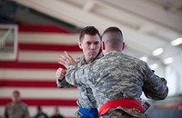 U.S. Army 1st Lieutenant Spencer Bolduc bouts with an opponent during the U.S. Army Garrison Rheinland-Pfalz Regional Modern Combatives Tournament located at Kleber Kaserne, Germany on Feb. 27, 2016.