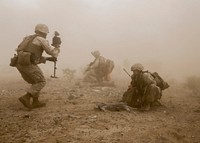 U.S. Marine Corps Sgt. Daniel D. Kujanpaa, left, a combat camera videographer with Marine Aviation Weapons and Tactics Squadron One (MAWTS-1) documents Marines with 1st Platoon, India Company, 3rd Battalion, 6th Marine Regiment, 2nd Marine Division, II Marine Expeditionary Force during a Marine Expeditionary Unit exercise at East Tact Airfield Ariz., April 8, 2016.