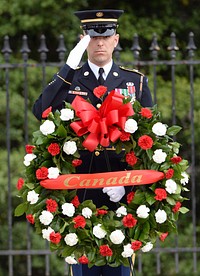 With full Ceremonial Honors presented, A member of the Honor Guard at Arlington National Cemetery, Arlington, Virginia, pays his respects during the wreath laying ceremony at the Tomb of the Unknowns in honor of the Prime Minister’s official visit to the United States.