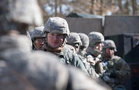 A group of U.S. Army Soldiers wait for a medical supplies briefing rifle during the demonstration portion of the U.S. Army Europe Expert Field Medical Badge (EFMB) qualification test at Baumholder, Germany on Mar. 17, 2016.
