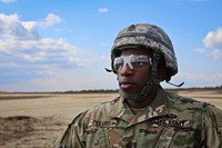 U.S. Army Sgt. Corey Collins, a soldier with the 404th Civil Affairs Battalion (Airborne), awaits the arrival of a New Jersey National Guard Black Hawk helicopter during sling load training at Coyle Drop Zone, Joint Base McGuire-Dix-Lakehurst, N.J., Feb. 29, 2016.