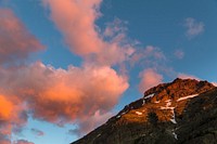Sunrise over Rising Wolf Mountain. Original public domain image from <a href="https://www.flickr.com/photos/glaciernps/27477033010/" target="_blank" rel="noopener noreferrer nofollow">Flickr</a>