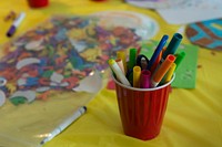 Color markers in red cup. Original public domain image from Flickr