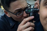 MEDITERRANEAN SEA (June 12, 2018) Hospital Corpsman 2nd Class Francisco Chavez, left, from El Paso, Texas, evaluates Operations Specialist Seaman Jonny Ramirez, from New York, during a medical check-up aboard the Arleigh Burke-class guided-missile destroyer USS Donald Cook (DDG 75) June 12, 2018.