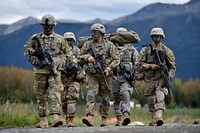 Paratroopers assigned to Hatchet Company, 1st Battalion, 501st Parachute Infantry Regiment, 4th Infantry Brigade Combat Team (Airborne), 25th Infantry Division, U.S. Army Alaska, move to an assembly area after executing a joint forcible entry exercise at Malemute Drop Zone on Joint Base Elmendorf-Richardson, Alaska, Aug. 23, 2016, as part of Exercise Spartan Agoge.