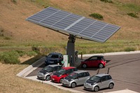 NREL,-owned electric vehicles (EVs) below solar canopy at the Vehicle Testing & integration Facility (VTIF), where vehicles are charged with photovoltaic (PV) - generated electricity and can provide backup energy to the grid when PV generation is low.