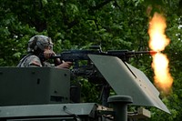 U.S. Army Pvt. Anthony Balac, assigned to the 2nd Platoon, 206th Military Police Company, New York Army National Guard, fires an M240B machine gun June 14, 2018, at Fort Drum, New York. Balac and his team came under simulated fire while providing support for Soldiers of 3rd Platoon who were conducting base security training.