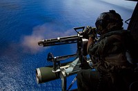 Cpl. Cristina Fuentes, a UH-1Y Venom helicopter crew chief assigned to Marine Medium Tiltrotor Squadron 262 (Reinforced), 31st Marine Expeditionary Unit, fires a GAU-17/A minigun during a fire support training exercise (FISTEX) over Farallon De Medinilla, Commonwealth of the Northern Mariana Islands, Sept. 16, 2016.