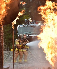 Fire protection specialist Airmen assigned to the 673rd Civil Engineer Squadron perform firefighter training on a simulated aircraft fire at Joint Base Elmendorf-Richardson, Alaska, Wednesday, Sept. 14, 2016. Aircraft live fire training is conducted periodically throughout the year at JBER to ensure Airmen are prepared to combat aircraft fuel fires. (U.S. Air Force photo/Justin Connaher). Original public domain image from Flickr