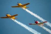 T-34 Mentors perform at the week-long AirVenture Oshkosh in Wisconsin, July 23, 2018. The International Federal Partnership (IFP) returns to the show for its 25th consecutive appearance this year.USDA Photo by Preston Keres. Original public domain image from Flickr