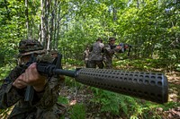 U.S. Marine Corps Sgt. David Bloxton, a scout sniper with 3rd Battalion, 25th Marine Regiment, posts security while his team practices crossing a danger zone during Exercise Northern Strike at Camp Grayling, Michigan, Aug. 11, 2018.