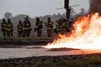 U.S. Air Force and Army firefighters assigned to 433rd Civil Engineering Squadron, Lackland Air Force Base, Texas, 4th Civil Engineer Squadron, Seymour Johnson Air Force Base, N.C., and 376th Engineer Firefighter Detachment, Ill., participate in a JP8 fuel burn training scenario at Sparta/Ft.