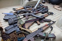 AK 47 rifles as seen after South West Special Forces destroyed Al Shabaab hideouts and recovered firearms in the on-going security operation in Labaatan Jirow neighbourhood situated in Baidoa, Bay, Somalia. Original public domain image from <a href="https://www.flickr.com/photos/au_unistphotostream/29389585022/" target="_blank">Flickr</a>