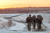 Paratroopers assigned to A Battery, 2nd Battalion, 377th Parachute Field Artillery Regiment, 4th Infantry Brigade Combat Team (Airborne), 25th Infantry Division, U.S. Army Alaska, leave Malemute drop zone after conducting airborne and 105 mm howitzer live fire training at Joint Base Elmendorf-Richardson, Alaska, Nov. 22, 2016.