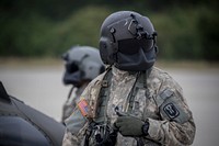 U.S. Army Staff Sgt. Timothy Witts, a UH-60L Black Hawk helicopter crew chief with the New Jersey National Guard's Det. 2 , C Company, 1-171st Aviation Regiment, prepares for a flight from Joint Base McGuire-Dix-Lakehurst, N.J. to North Carolina on Sept. 17, 2018.