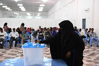 A delegate from Somaliland votes during the ongoing electoral process in Mogadishu, Somalia, on December 19, 2016. UN Photo / Ilyas Ahmed. Original public domain image from Flickr