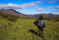 Julia collects garbage at Copter Peak Campsite