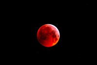 Super blood moon on black background. Original public domain image from Flickr