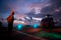 161117-N-NT265-028 SOUTH CHINA SEA (Nov. 17, 2016) Petty Officer 3rd Class Robert McGuire, assigned to the forward-deployed Arleigh Burke-class guided-missile destroyer USS McCampbell (DDG 85), stands by during flight quarters with an MH60R Seahawk helicopter, assigned to the “warlords” of Helicopter Maritime Strike Squadron (HSM) 51, during Cooperation Afloat Readiness and Training (CARAT) 2016.