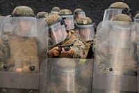 Marines with Echo Battery, Battalion Landing Team, 2nd Battalion, 5th Marines, 31st Marine Expeditionary Unit and military police with Combat Logistics Battalion 31, 31st MEU, conduct non-lethal weapons training at Camp Hansen, Okinawa, Japan, Dec. 29, 2016.