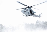 A U.S. Marine Corps reserve UH-1Y Huey from Marine Aircraft Group 49 prepares to deploy New Jersey National Guard soldiers at a landing zone during a joint training exercise on Joint Base McGuire-Dix-Lakehurst, N.J., Jan. 10, 2017. The Marine Corps reserve provided airlift and close air support to Alpha Company soldiers of 1-114. The 1-114, which is part of the 50th Infantry Brigade Combat Team, is participating in a series of training events that will culminate this summer at an eXportable Combat Training Capability exercise on Fort Pickett, Va. The Army National Guard’s eXportable Combat Training Capability program is an instrumented Brigade field training exercise designed to certify Platoon proficiency in coordination with First Army. (U.S. Air National Guard photo by Tech. Sgt. Matt Hecht/Released). Original public domain image from Flickr