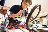 A Northern Arizona University student makes final adjustments to their turbine components before their wind tunnel testing.