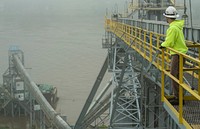 Consolidated Grain and Barge operations at the Riverside Terminal, in Cincinnati, OH, on May 10, 2017. Trucks deliver soybeans for inspection and purchase, then it is loaded onto barges for shipment to New Orleans and overseas customers.USDA Photo By Lance Cheung. Original public domain image from Flickr