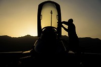 Senior Airman Alexis Garrido, a 455th Expeditionary Aircraft Maintenance Squadron dedicated crew chief, removes paint from an F-16 Fighting Falcon on Bagram Airfield, Afghanistan, June 16, 2017.