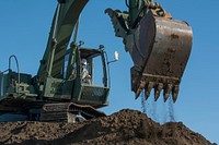 US soldier using excavator. Original public domain image from Flickr