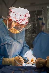 MEDITERRANEAN SEA (July 11, 2017) Lt. Cmdr. Krista Puttler, ship's surgeon aboard the aircraft carrier USS George H.W. Bush (CVN 77), makes incisions during a surgical operation.