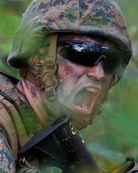 A U.S. Marine assigned to 2nd Battalion, 23rd Marine Regiment, shouts orders while conducting a live-fire exercise during the 4th Marine Division Annual Rifle Squad Competition at Joint Base Elmendorf-Richardson, Alaska, Aug. 7, 2017. Rifle squads from 1st and 2nd Battalions, 23rd Marine Regiment and 3rd Battalion, 25th Marine Regiment, competed in events that highlighted offensive/defensive operations, patrolling techniques, combat marksmanship, physical endurance, and overall small unit leadership. (U.S. Air Force photo by Alejandro Peña). Original public domain image from Flickr