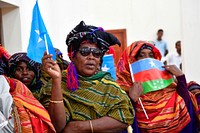 Women wave flags to welcome the Special Representative of the United Nations Secretary-General (SRSG) for Somalia, Michael Keating and other officials who were on a working visit to Barawe, Lower Shabelle region on November 15, 2017.