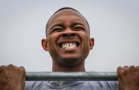 U.S. Air Force Staff Sgt. Garion Reddick fights to hold himself up during the flex arm hang portion of a German Armed Forces Badge for Military Proficiency test at Joint Base McGuire-Dix-Lakehurst, N.J., Sept. 17, 2017. Reddick is assigned to the 108th Maintenance Squadron. (U.S. Air National Guard photo by Master Sgt. Matt Hecht). Original public domain image from Flickr