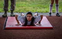 U.S. Air Force Airman 1st Class Erica Garcia prepares for the sprint portion of the German Armed Forces Badge for Military Proficiency at Joint Base McGuire-Dix-Lakehurst, N.J., Sept. 17, 2017. Garcia is assigned to the 108th Logistics Readiness Squadron. (U.S. Air National Guard photo by Master Sgt. Matt Hecht). Original public domain image from Flickr