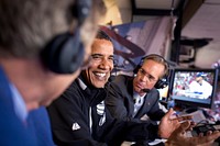 President Barack Obama joins Fox Sports announcers Joe Buck, right, and Tim McCarver, left, in the broadcast booth at the MLB All-Star Game in St. Louis, July 14, 2009.