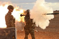 U.S. Army Maj. Gen. James Jarrard, left, the commander of Special Operations Joint Task Force-Operation Inherent Resolve, provides assistant gunner support to a member of the 5th Special Forces Group during counter ISIS operations in southern Syria Nov. 22, 2017.