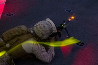 MEDITERRANEAN SEA (March 2, 2018) A U.S. Marine assigned to Battalion Landing Team, 2nd Battalion, 6th Marine Regiment, 26th Marine Expeditionary Unit, fires his M4 carbine rifle during a night deck shoot aboard the San Antonio-class amphibious transport dock USS New York (LPD 21) March 2, 2018.