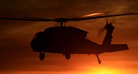 A California National Guard UH-60 Black Hawk helicopter from B Company, 1st Battalion, 140th Aviation Regiment, departs Camarillo Airport in Camarillo, California, at sunset Sun., Dec. 10, 2017, for a return to Joint Forces Training Base Los Alamitos after making its last water drops of the day on the Thomas Fire burning in Ventura County.