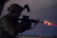 An Airman assigned to the 3rd Air Support Operations Squadron, fires an M4 carbine during night live-fire sustainment training at Joint Base Elmendorf-Richardson, Alaska, Nov. 29, 2017. During the night live-fire training exercise, the 3rd ASOS Airmen honed their marksmanship skills, transitioning between firing the M9 pistol and M4 carbine. (U.S. Air Force photo by Alejandro Peña). Original public domain image from Flickr