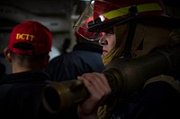BALTIC SEA (April 23, 2018) Machinist&#39;s Mate 2nd Class Jordan Youngbluth, assigned to the Arleigh Burke-class guided-missile destroyer USS Porter (DDG 78), carries an eductor during damage control drills, April 23, 2018.