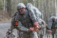 Wyoming Army National Guard Spc. Wyatt Schiermeyer evacuates a simulated casualty while competing in the National Guard Best Warrior Region VI 2018 at Joint Base Elmendorf-Richardson, Alaska, May 15, 2018. National Guard Best Warrior Region VI 2018 is a four-day competition that tests Soldiers' mental and physical toughness through a series of events that demonstrate technical and tactical proficiency to determine the top non-commissioned officer and junior enlisted Soldier. The competitors represent the top Soldiers from Alaska, Idaho, Montana, North Dakota, Oregon, South Dakota, Washington, and Wyoming. (U.S. Air Force photo by Alejandro Peña). Original public domain image from Flickr