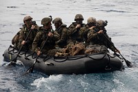 U.S. Marines with Bravo Company, Battalion Landing Team, 1st Battalion, 1st Marines, launch a Combat Rubber Raiding Craft from the well deck of the USS Green Bay (LPD 20) during an amphibious raid as part of Certification Exercise off the coast of Okinawa, Japan, April 17, 2018.